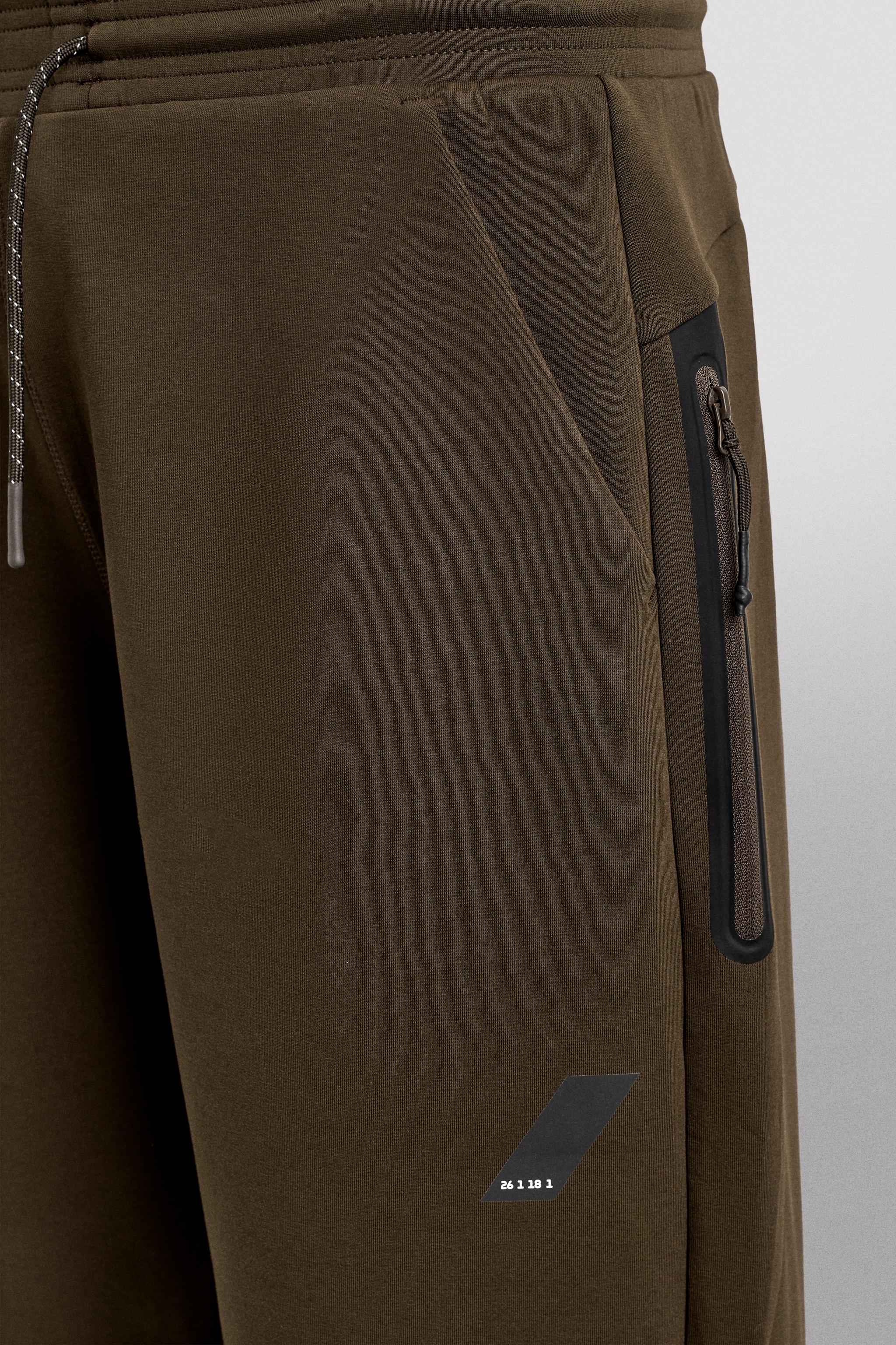 TECHNICAL PANTS WITH ZIPPERS